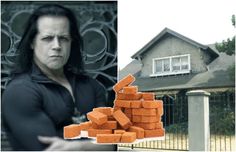 a man standing in front of a house next to a pile of orange brick blocks