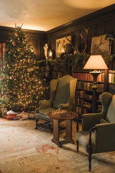 a living room filled with furniture and a christmas tree