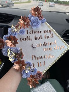 a graduation cap with flowers and butterflies on it that says, i chose my path but god changed my plans