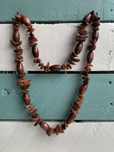 Vintage Boho Wooden Necklace Natural Wooden Beads This necklace is made of natural wood beads that are irregular in shape combined with ones that are smooth and of a regular shape. All natural wood, varnished.  Good vintage condition.  Length: info coming soon Elephant Teapot, Mens Beaded Necklaces, Wooden Shades, Wooden Bead Necklaces, Beads For Sale, Purple Bag, Wooden Necklace, Wood Necklace, Boho Necklace