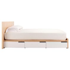 a bed with two drawers underneath it and a white blanket on top of the bed