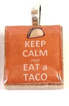 an orange and white sign that says keep calm and eat a taco on it