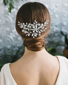 a woman wearing a bridal hair comb