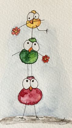 three birds standing on top of each other with flowers in their beaks and eyes