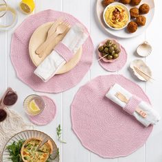 pink placemats and plates with food on them