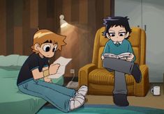 two young men sitting on the floor in front of a bed, one reading a book