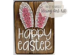 an easter card with two bunny ears and string art kit on it's side