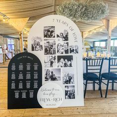 a large sign with photos on it in front of tables set up for an event