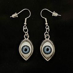 Please read descriptions thoroughly for sizes and materials. This is a pair of earrings with eerily realistic blue glass eyeballs, that seem to always be looking at you. They are a really fun and a little spooky! They are hung from standard hypoallergenic ear wires. Earrings are also available to be hung on 925 Sterling Silver ear wires, clip ons, 16-18mm Surgical Steel Hoops or 12-14mm Surgical Steel Hoops. Make sure to check out my shop for more hair pins, jewelry, earrings, accessories, and a Eyes Creepy, Eyeball Earrings, Eye Accessories, Crazy Earrings, Creepy Eyes, Pins Jewelry, Fake Eye, Halloween Eyes, Realistic Eye