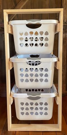 three plastic laundry baskets stacked on top of each other