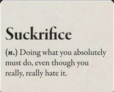 a sign that says suckriffce on the side of a white wall