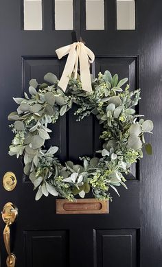a wreath is hanging on the front door