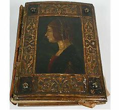 an old book with a portrait of a woman in gold on the front and back cover