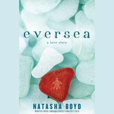 a red heart sitting on top of some white sea glass pebbles with the words, neversea