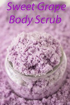 a glass jar filled with purple bath scrub on top of a white countertop next to the words, sweet grape body scrub