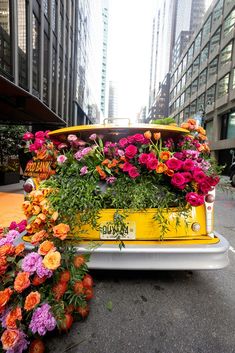 multicolor-flowers-in-yellow-cab Mission Statement Display, Creative Centerpieces, Fundraiser Ideas, Nyc Food, Bouquet Design, Work Party, Decoration Inspiration, Flower Decoration, Grand Entrance