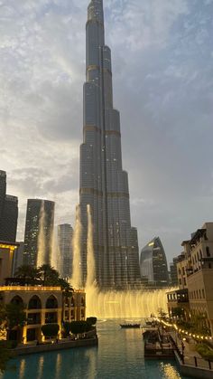 the burj building is surrounded by water fountains