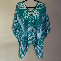 Mudpie Poncho Brand: Mudpie Size: One Size Color: Teal, Turquoise, Light Blue, White Material: Linen Condition: New With Tag Features: This Fun Poncho Features A Teal/Turquoise Shell And Water Pattern, Linen Material And Sewn At Sides To Create Sleeves. Smoke Free Home. Water Pattern, Boho Poncho, Womens Poncho, Pie Tops, Water Patterns, Linen Material, Teal Turquoise, Beach Fashion, Mud Pie