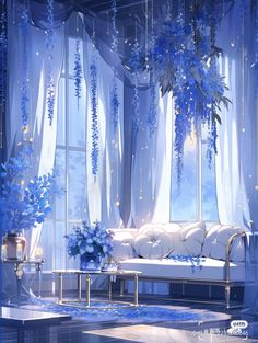 a living room filled with furniture and blue flowers hanging from the ceiling next to windows