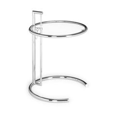 a round glass table with metal legs and a shelf on one side that holds a bottle