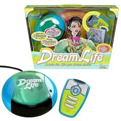an electronic toy with a green and blue mouse next to it's packaging on a white background