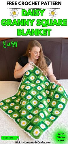 a woman is holding up a granny square blanket