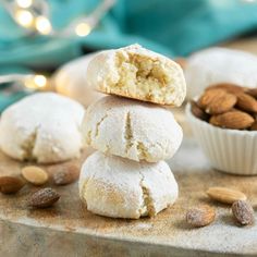 almonds and powdered sugar are stacked on top of each other