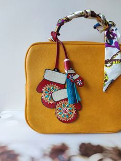 "Just have a look at this cute leather Christmas Blue Red Mittens with Mandala Bag Charm: Mittens on one side and nice small Mittens with tassel on the other side. I made this Christmas Bag Charm from high quality Turkish leather. Then it was hand-painted and decorated with sparkling small crystrals. Please Note that this chatm is painted duble-side that makes it more beautiful. Measurements: Width of Mittens approximately 3 inches (9 cm). Height of Mittens approximately 5.2 inches (13 cm). Heig Winter Purses, Leather Christmas, Red Mittens, Christmas Blue, Winter Mittens, Profile Header, Key Bag, Bag Charms, Veg Tan Leather