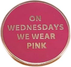 a pink button that says on wednesdays we wear pink