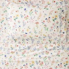 a white sheet with colorful flowers on it