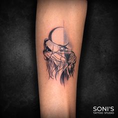 a tattoo on the leg of a person with a lion head and crescent moon behind it