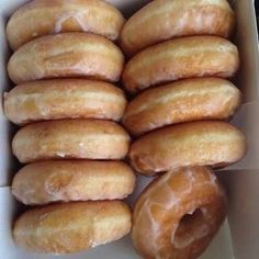 there are many glazed donuts in the box