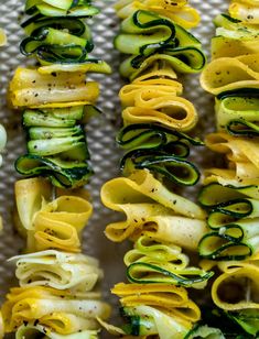 zucchini and spiraled noodles are arranged on a tray