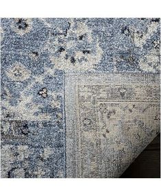 an area rug with blue and white colors