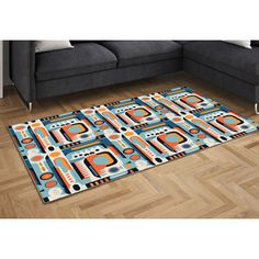 a living room area rug with an orange and blue design