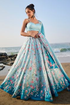 Light blue A-line flare lehenga with attached can-can, accentuated with all over floral print and sequin embellishments. Paired with a sweetheart neckline blouse and dupatta. Component: 3 Pattern: Print Type Of Work: Floral Neckline: Sweetheart Neck Sleeve Type: Sleeveless Fabric: Satin Georgette Color: Blue Other Details:  Attached can-can Floral print border dupatta Ombre hem effect lehenga Occasion: Reception,Sangeet - Aza Fashions Floral Lehngas, Blue Floral Lehenga, Light Blue Lehenga, Floral Lengha, Flare Lehenga, Lehnga Design, Indian Fits, Pastel Lehenga, Print Lehenga