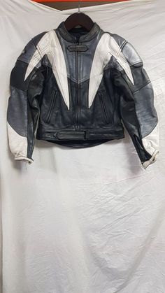 Dannisport Black White Gray Leather Women's Motorcycle Jacket Size 14 UK, EUR 42 Grade B Unique Item Code: HT *BB4E-26168 Brand: Dannisport Model: Grading: B Additional Product Info: Notes: good overall condition but may have the odd scuff/mark. Smells like it has been in storage for some time so would recommend a clean. Composition: 100% Leather. Size: EUR-42, GB-14, US 12 Measurements are approximate: length 18" (46CM) Waist 17" (43cm) Sleeve 21 (54cm) Bundled Items: None Does not come with any other items such as accessories, cables, etc. You will only get what is pictured.  If it is not pictured, you will not receive it unless otherwise mentioned in this description. This item is graded as Grade B.  Grading definition: A. Items that are classified as Grade A are in good condition with Women’s Motorcycle Jacket, Motorcycle Jacket Women, Motorcycle Jackets, Motorcycle Women, Gray Leather, Fashion Pieces, Grey Leather, Biker Jacket, Motorcycle Jacket