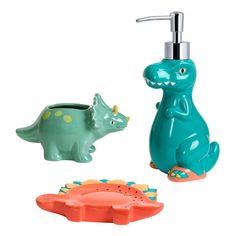 a toothbrush holder and soap dispenser in the shape of a dinosaur