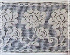 an old doily with flowers on it is shown in white and blue colors, as well as black dots