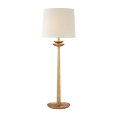 a gold lamp with a white shade on it