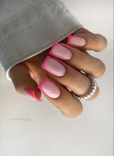 a woman's hand with pink and white nails