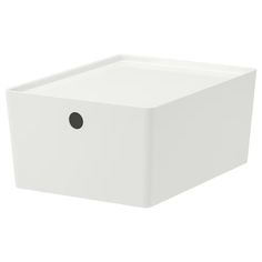 a white square box with a black dot on the front and bottom corner, sitting against a white background