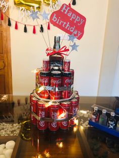 a birthday cake made to look like cans and sodas are stacked on top of each other