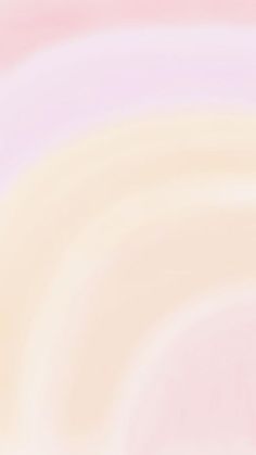 a blurry pink and yellow background with small circles