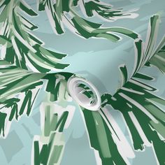 a green and white wallpaper with palm leaves on the back ground, in an abstract manner