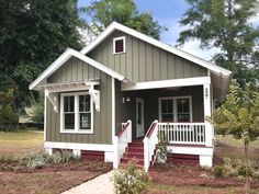 An easy-to-build Craftsman cottage with two bedrooms, one bath, and a private front porch for watching the world go by. 2 bedrooms - 1 bath 24' W x 36' D x 20' H 1 story 725 square feet ﻿Delivery window: one week. Under 1000 Sq Ft House Plans, 1000sq Ft House Plans, Double Loft Tiny House, Tiny Modern House, Farmhouse Cottage Plans, Small Ranch House Plans, Ranch Cottage, Small Cottage Plans, Mother In Law Cottage