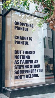 a sign on the side of a building saying growth is painful change is painful but there's nothing as painful as staying stuck somewhere you don't belong