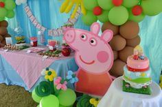 a peppa pig birthday party with balloons and decorations