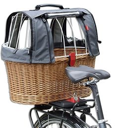 a bicycle with a basket attached to it's handlebars and seat cover