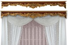 an ornate gold and white window curtain with sheer curtains on the sides, along with a wooden frame